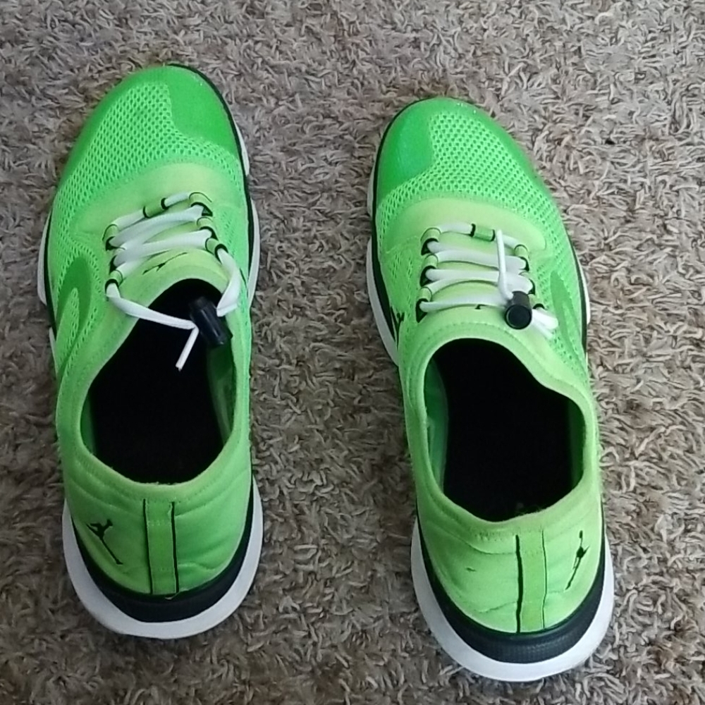 Green, white and black Jordan running shoe